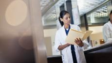 Healthcare worker looking at files