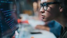 Worker looking at computer code