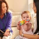 Parent and child talking to provider