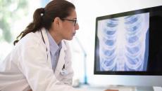 Doctor looking at an X-ray on a computer screen