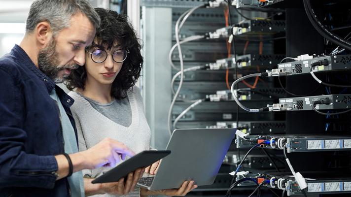 IT and cybersecurity leaders in server room