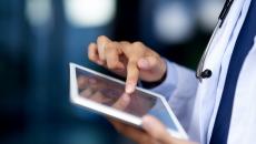 Healthcare worker using tablet