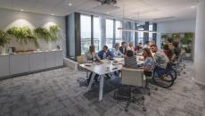 Health planners gathered at a table for a meeting