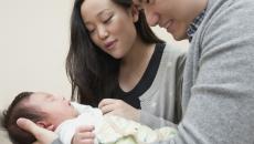 Couple holding baby