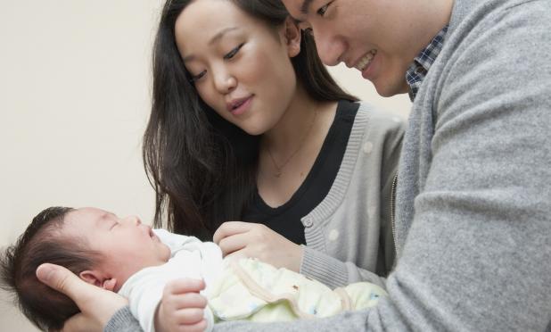 Couple holding baby