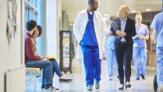 Medical staff walking down hospital hallway