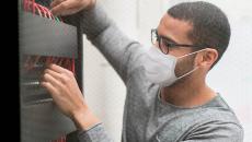 Photograph of a man working on a server