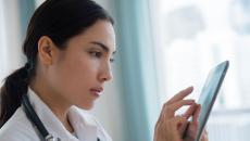 Healthcare worker using tablet