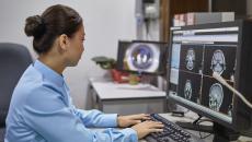 A radiologist examining X-ray images