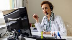 Physician prescribing medication via telehealth